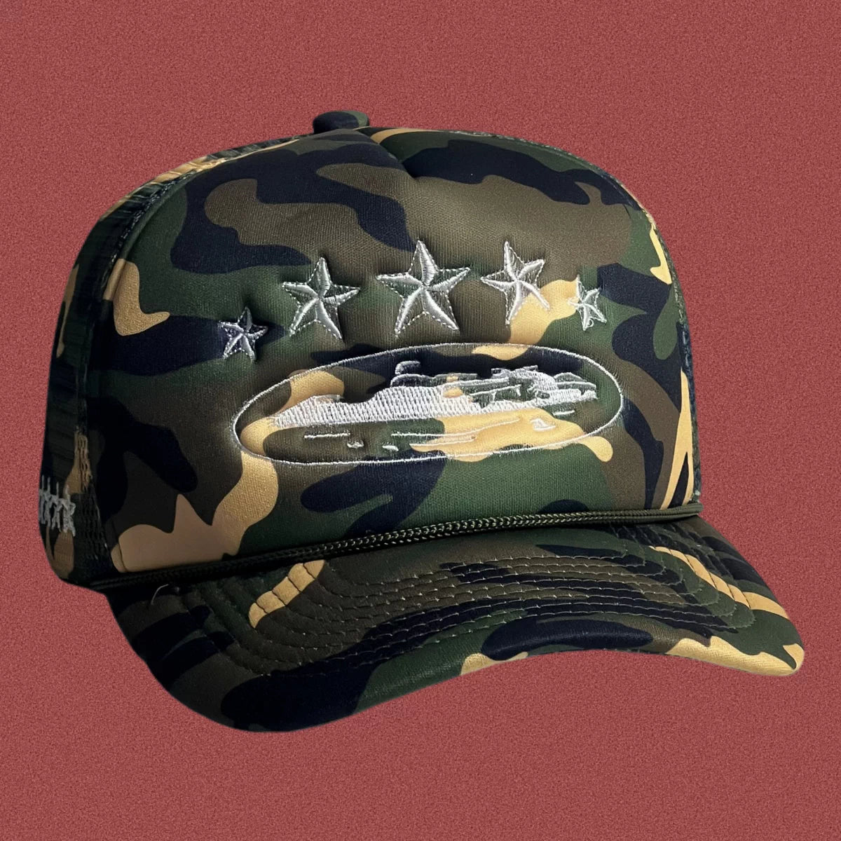 Corteiz Vintage Camo Trucker Hat with White Stars and Cruise Ship Graphic