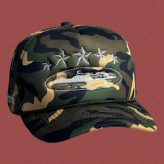 Corteiz Vintage Camo Trucker Hat with White Stars and Cruise Ship Graphic